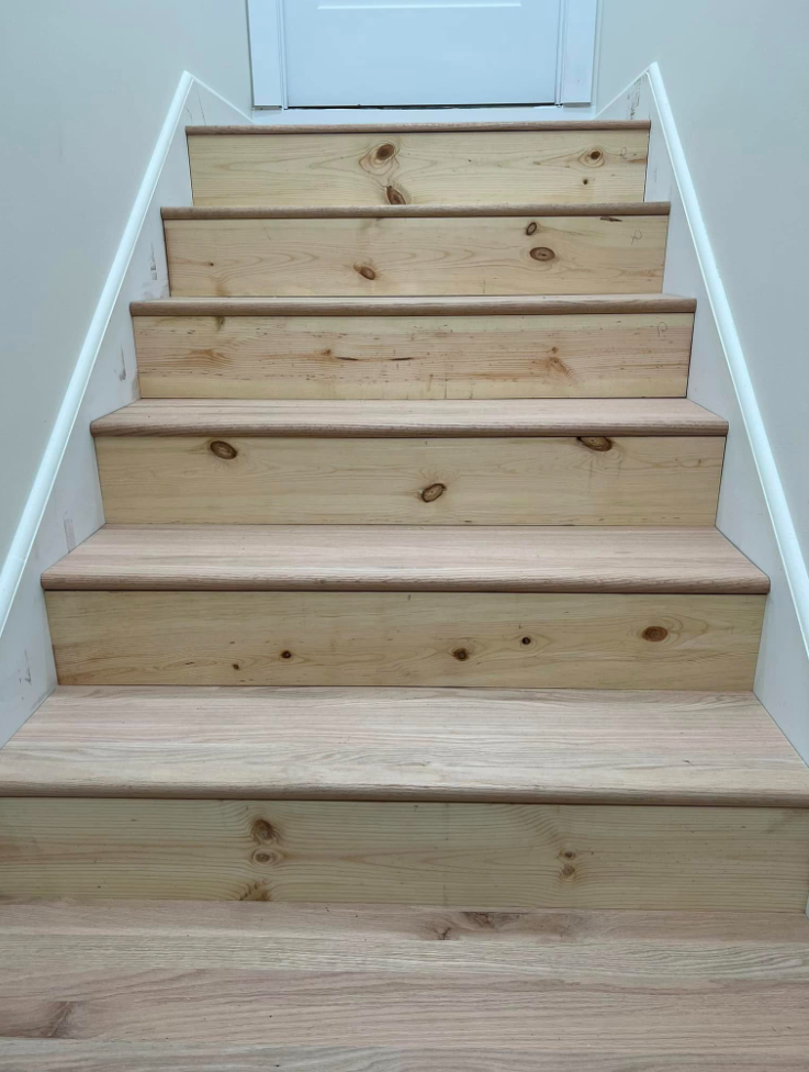 New red oak stair treads and pine risers installed in a home interior